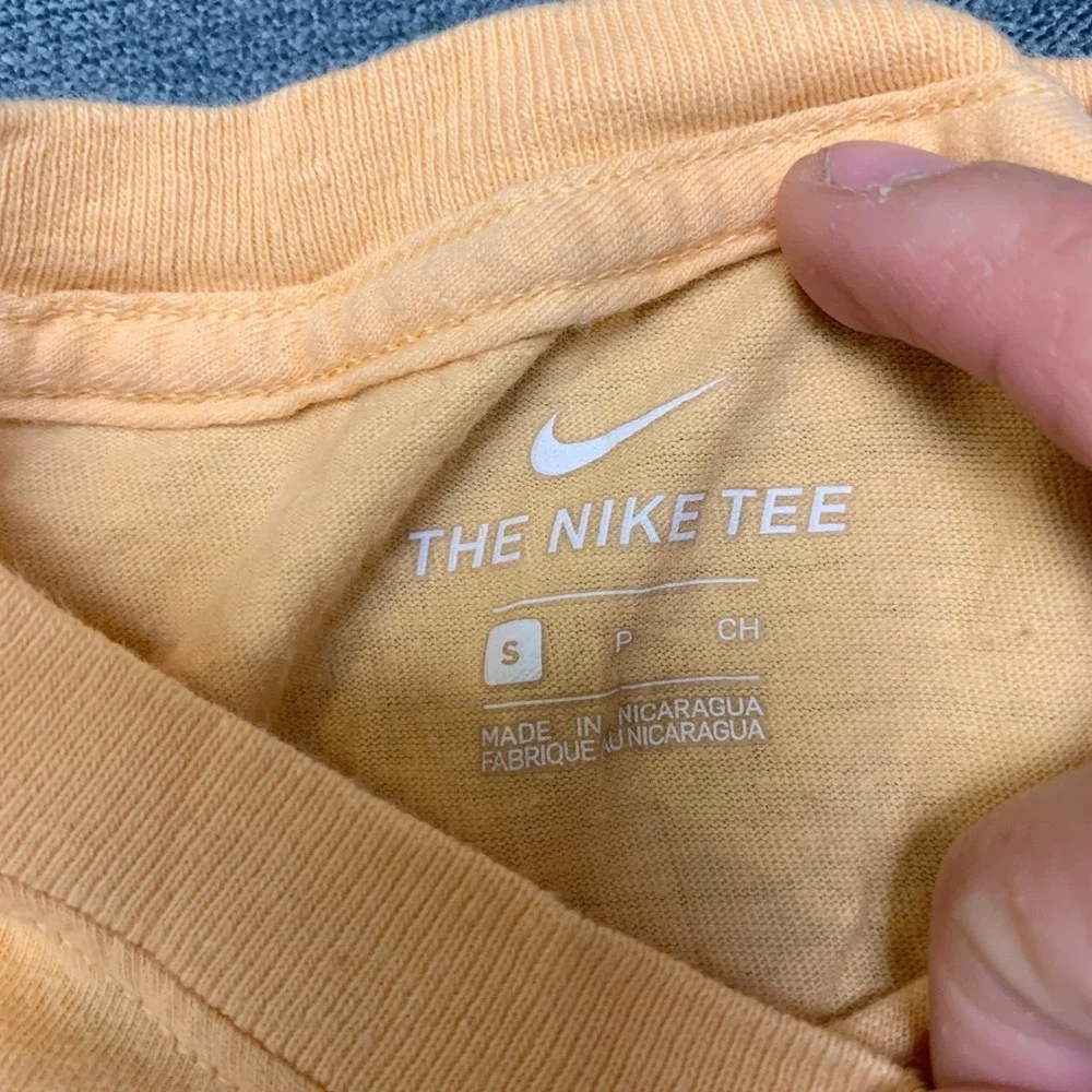 The Nike T Shirt Womens Small Peach Swoosh Logo Crew Neck Short Sleeve Pullover